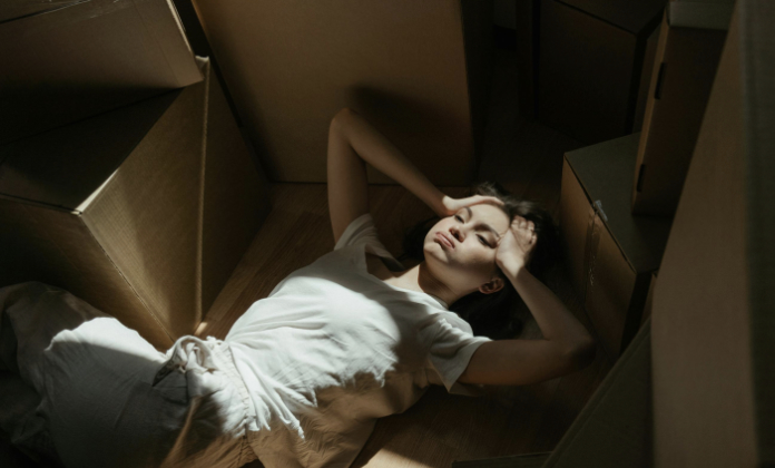Woman surrounded by boxes